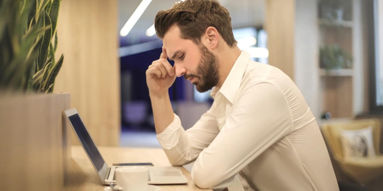 stressed-client-looking-at-computer