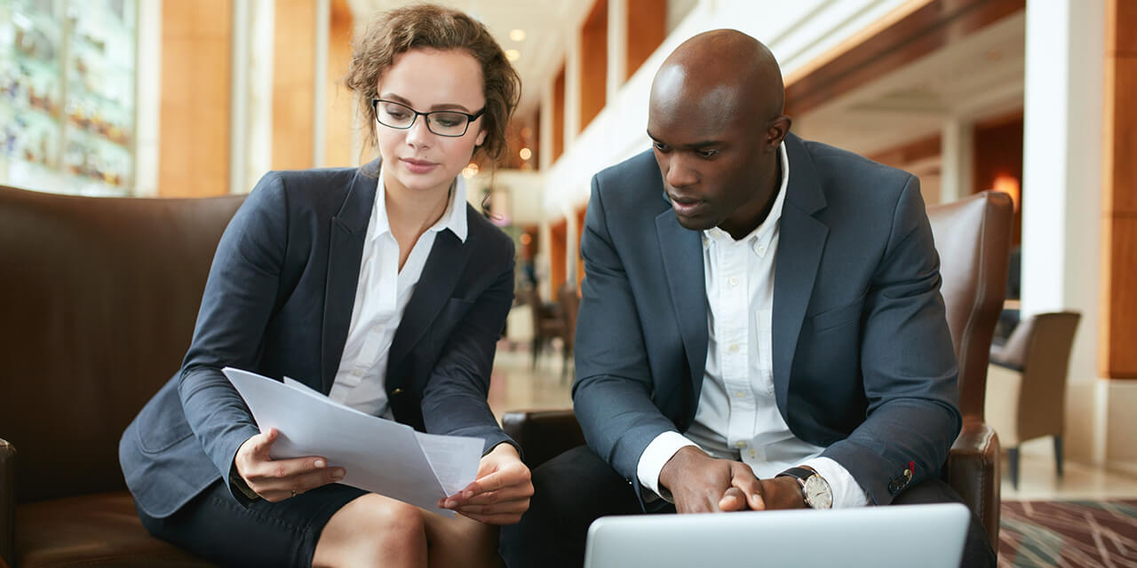 two-employees-going-over-docuements